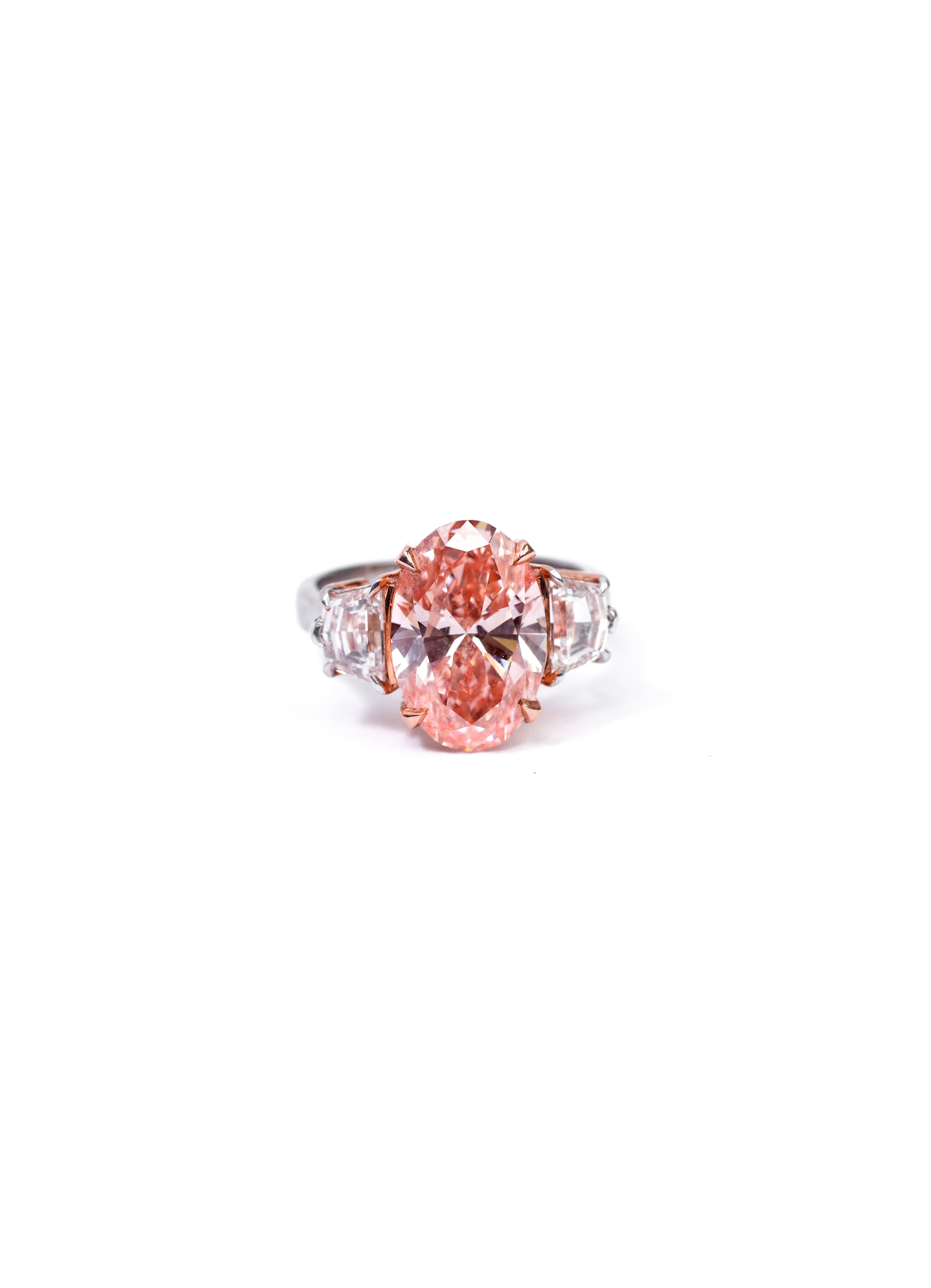Peach Oval and Emerald Cut Side Stone Ring